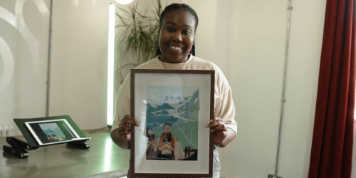 Parys Gardner holding up her artwork for Cabot Conversations